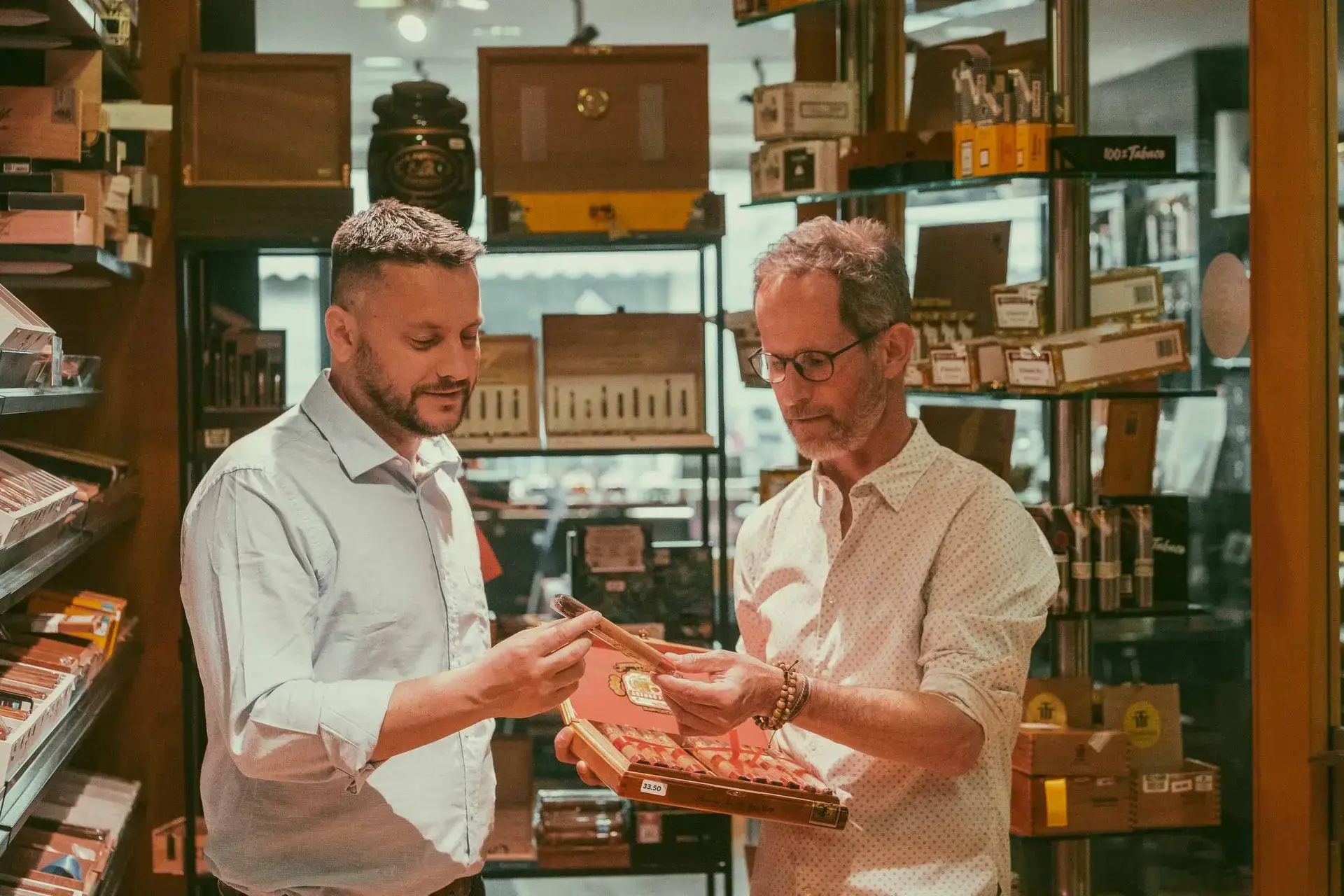 Histoires de Cigares owner and staff discussing premium cigars in the shop
